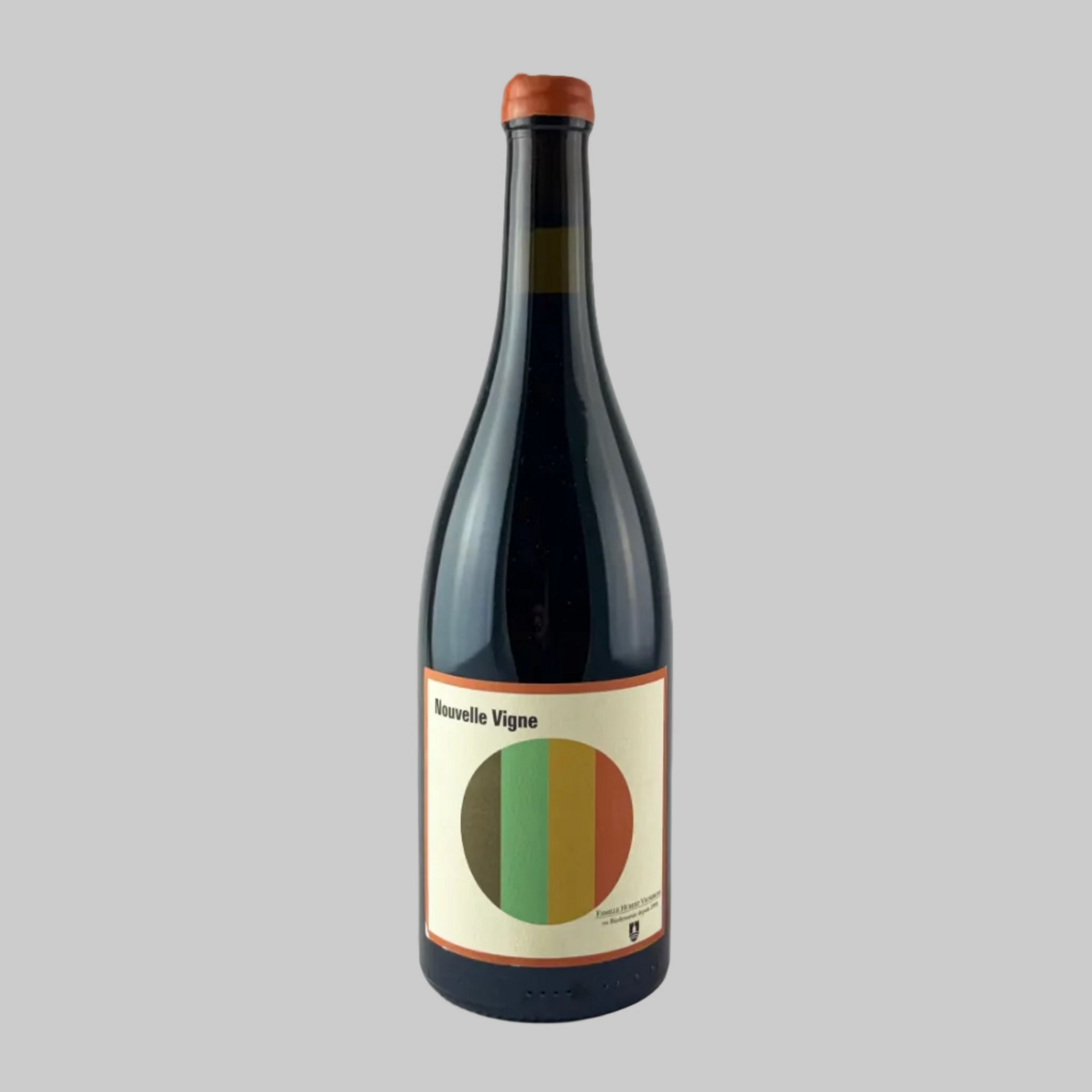 Bottle of Nouvelle Vigne red wine with a beige label and rainbow colour circle on a grey background.