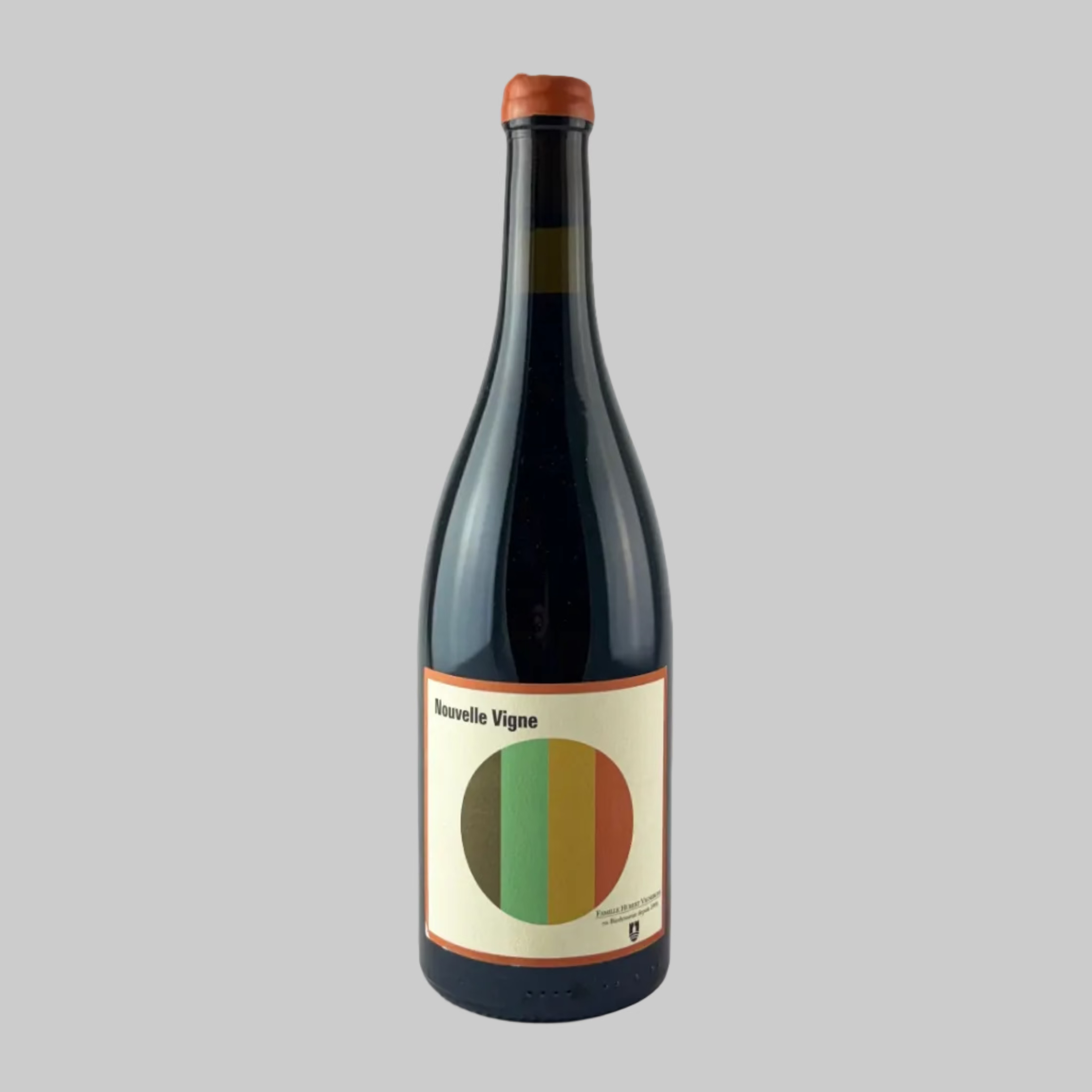 Bottle of Nouvelle Vigne red wine with a beige label and rainbow colour circle on a grey background.