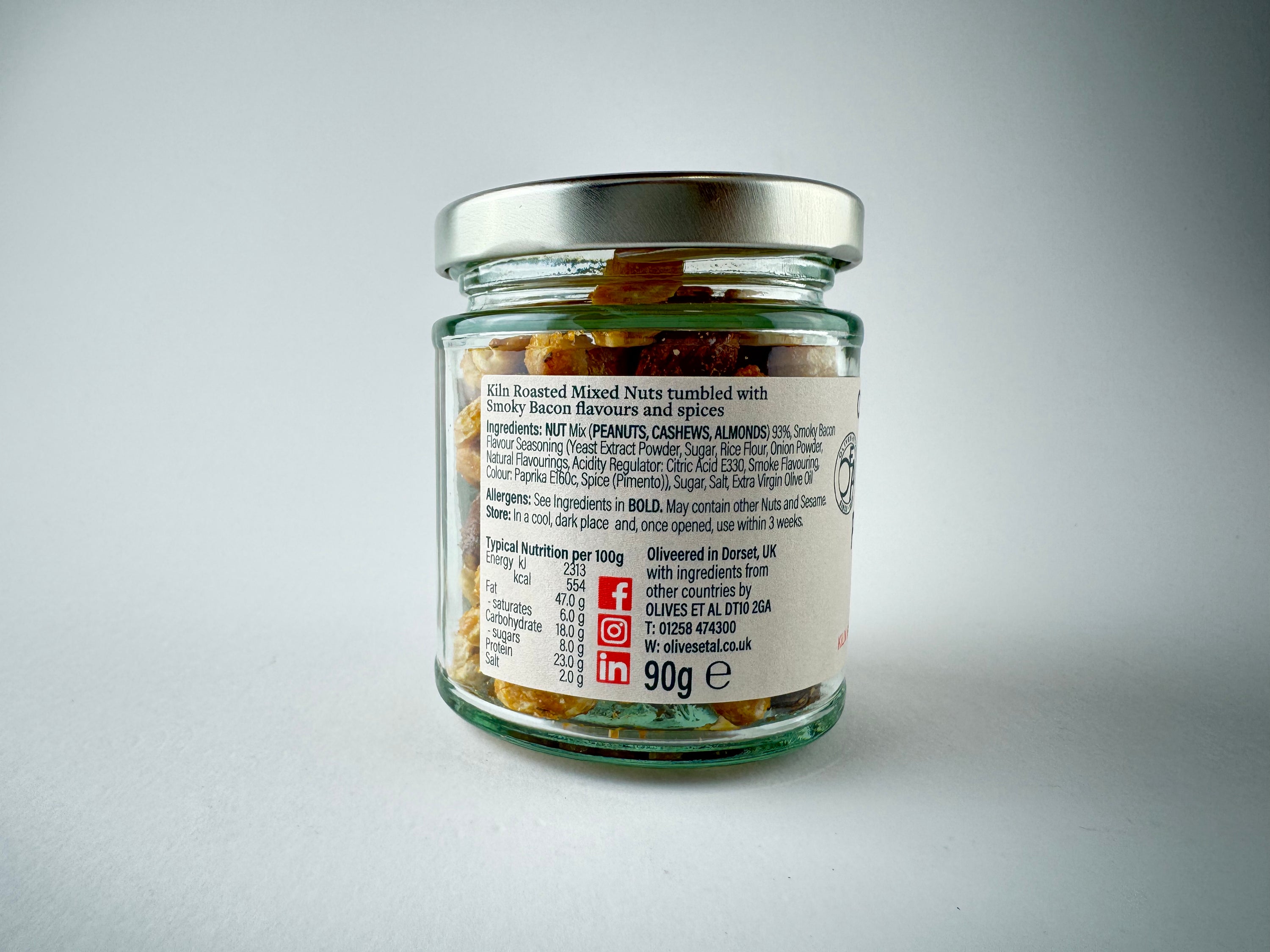 Pigs in Blanket Kiln Roasted Nuts in a festive snack packet on a grey background
