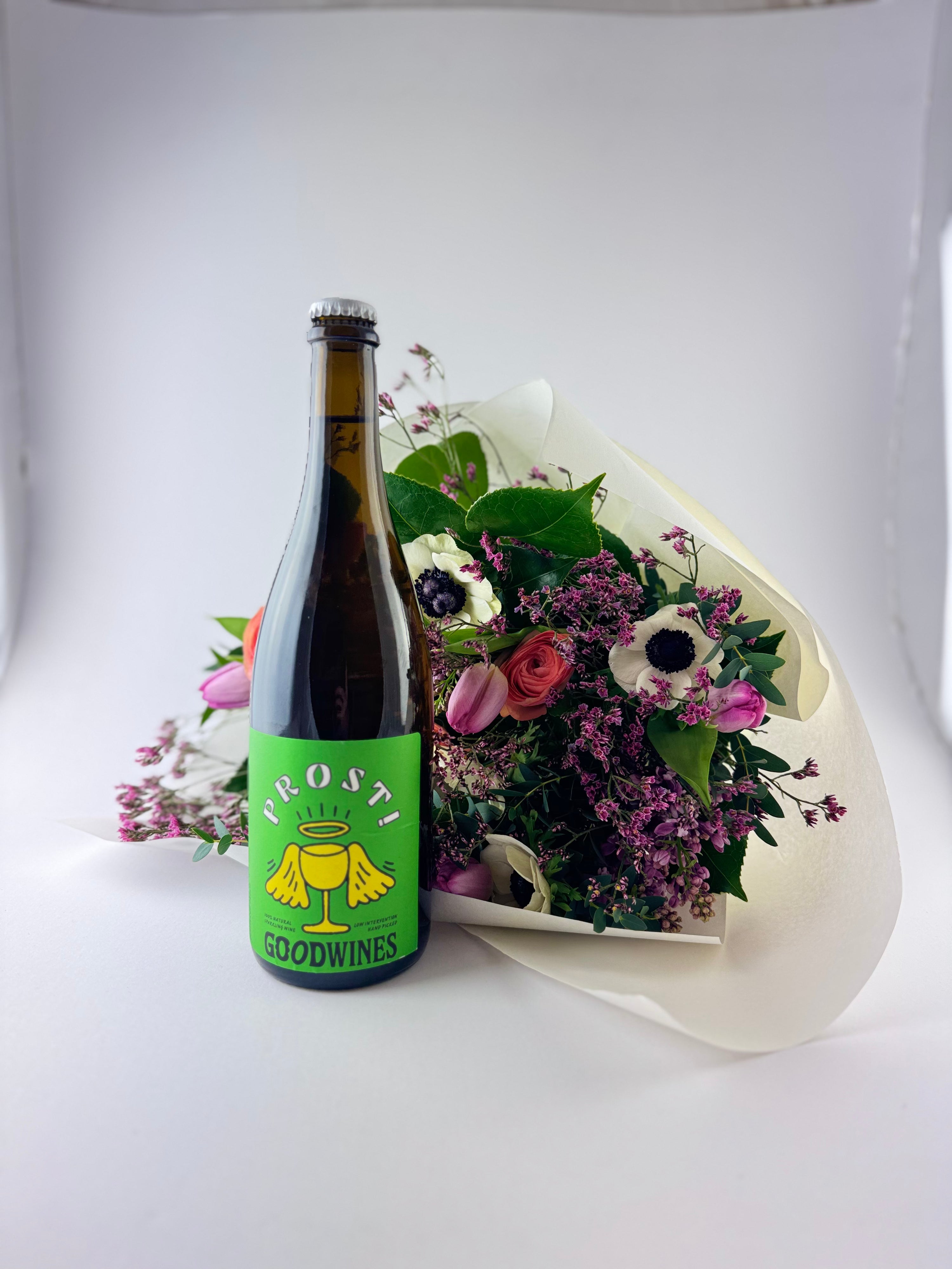 All Natty Valentines Edit gift selection with wine and snacks on a grey background