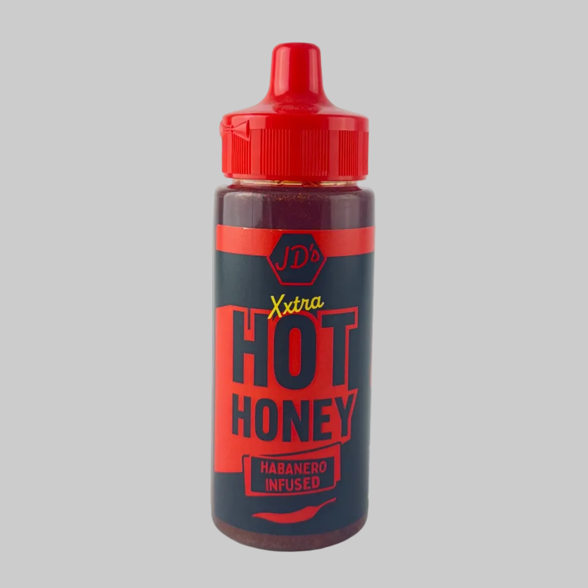 Bottle of JD's Habanero Infused Extra Hot Honey with red cap on a grey background


