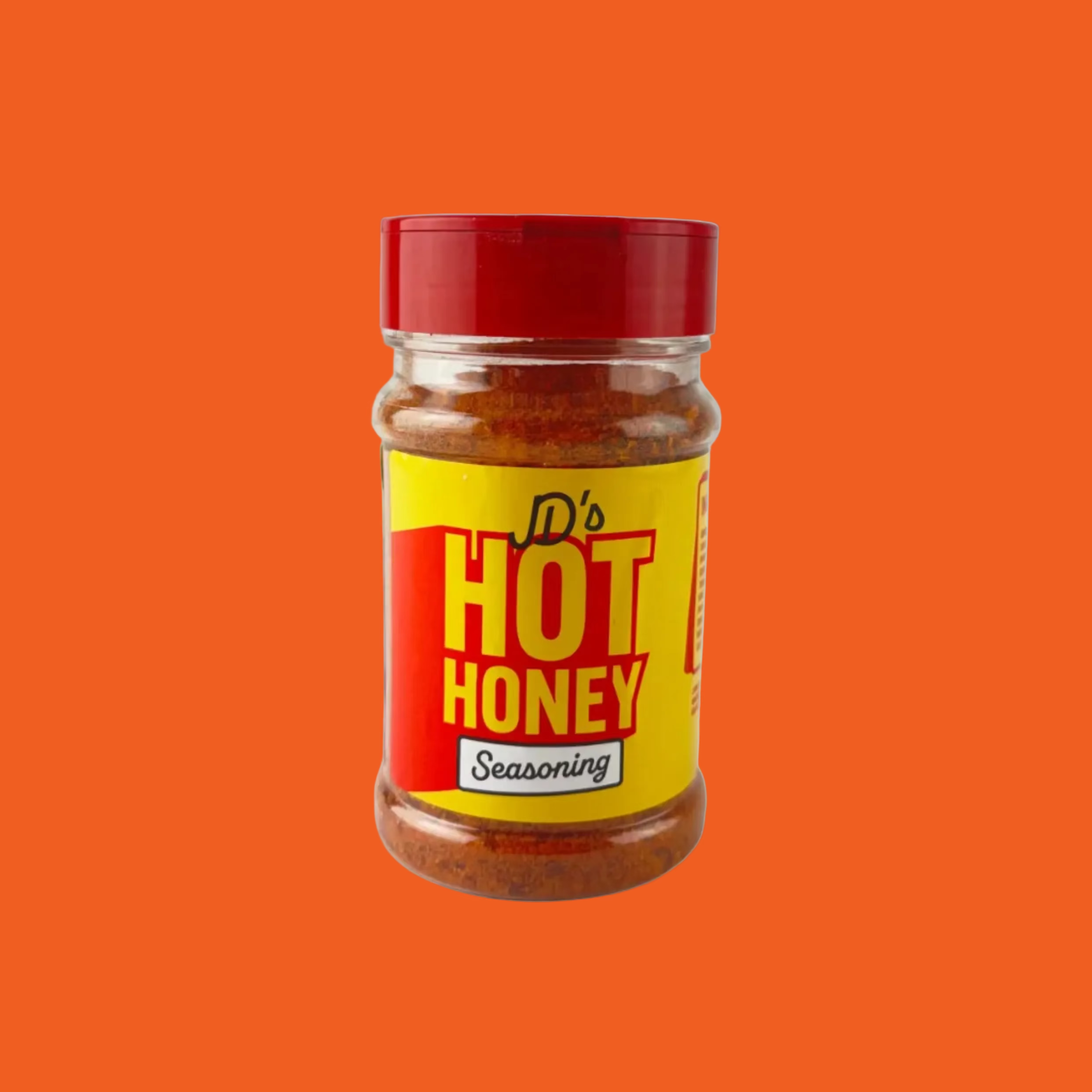Jar of D's Hot Honey Seasoning on a orange background