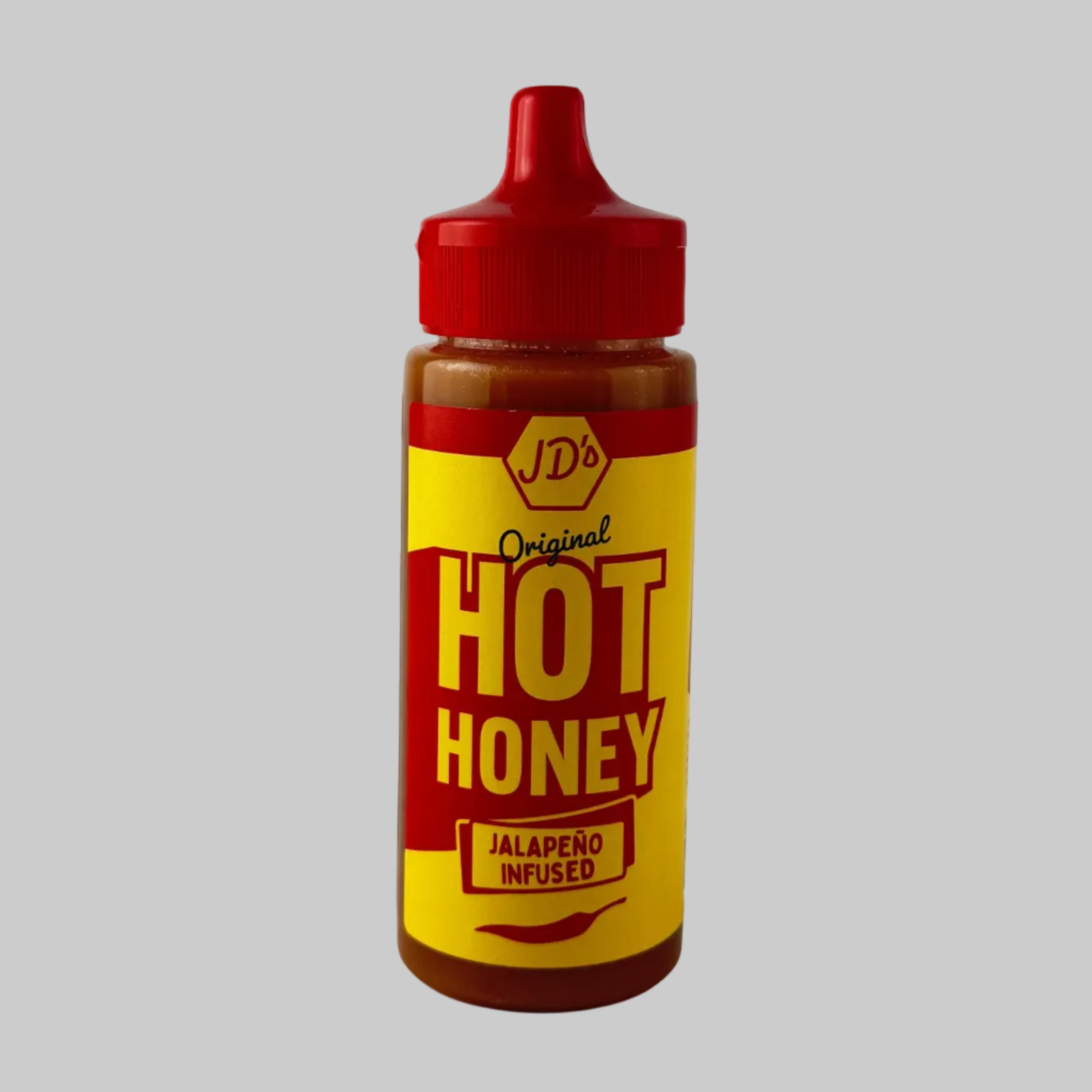 Bottle of JD's Original Jalapeno Infused Hot Honey in a red and yellow bottle