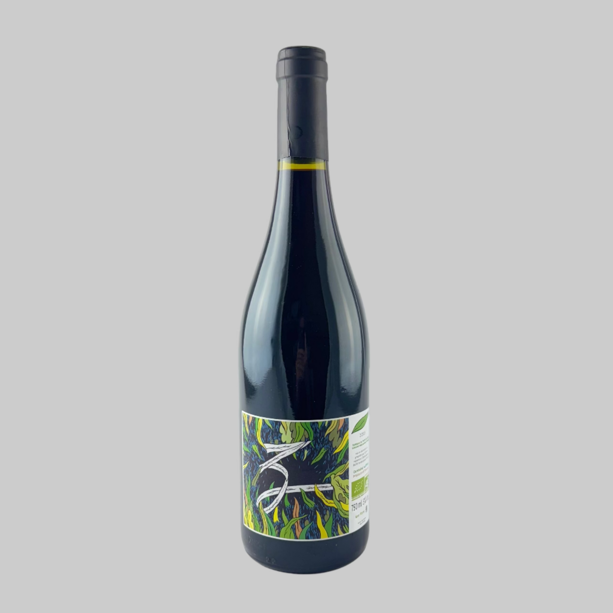 Bottle of Les Vignerons d'Estezargues Cuvee Z wine with a colorful label on a grey background