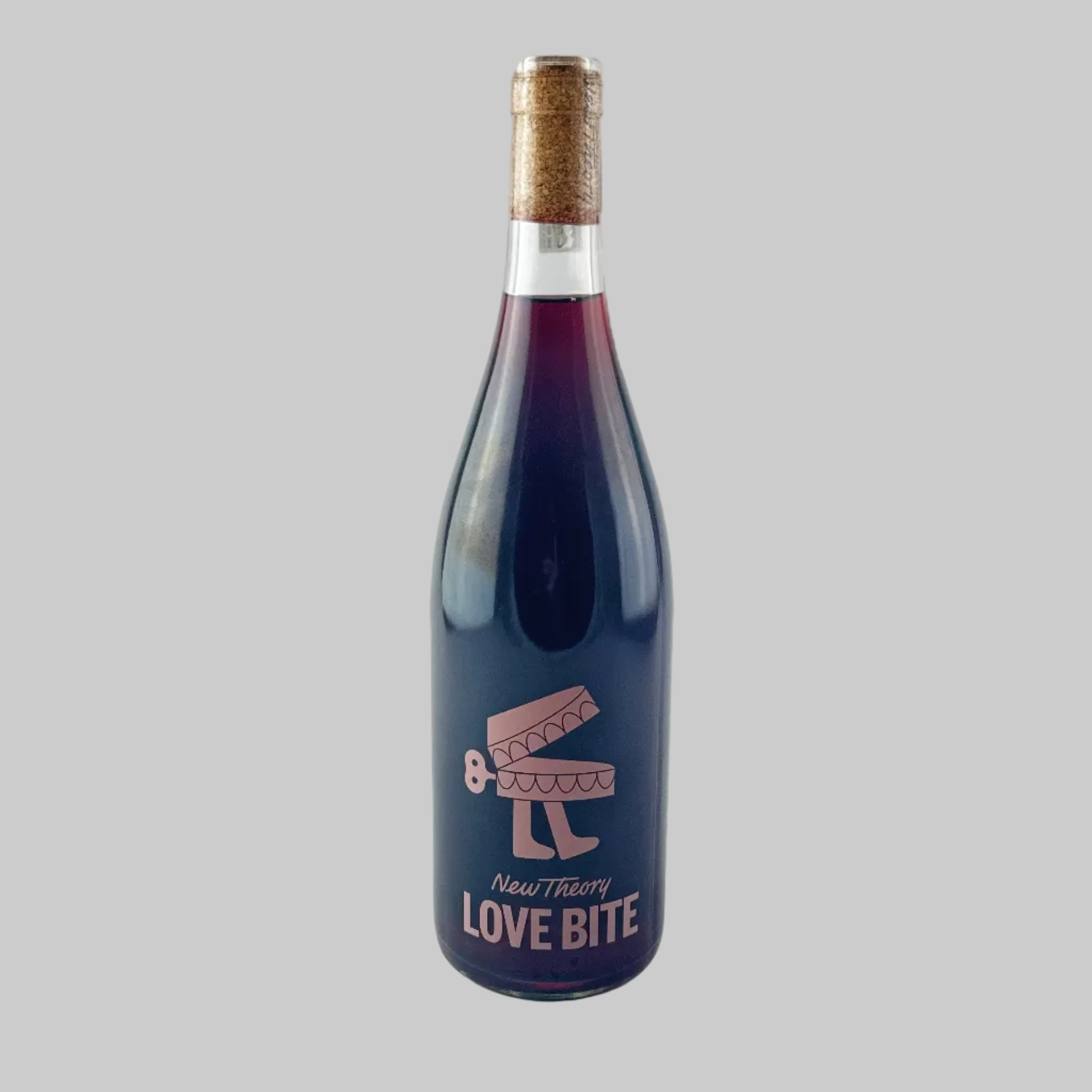 Bottle of New Theory Love Bite red wine with pink and blue label on a grey background.