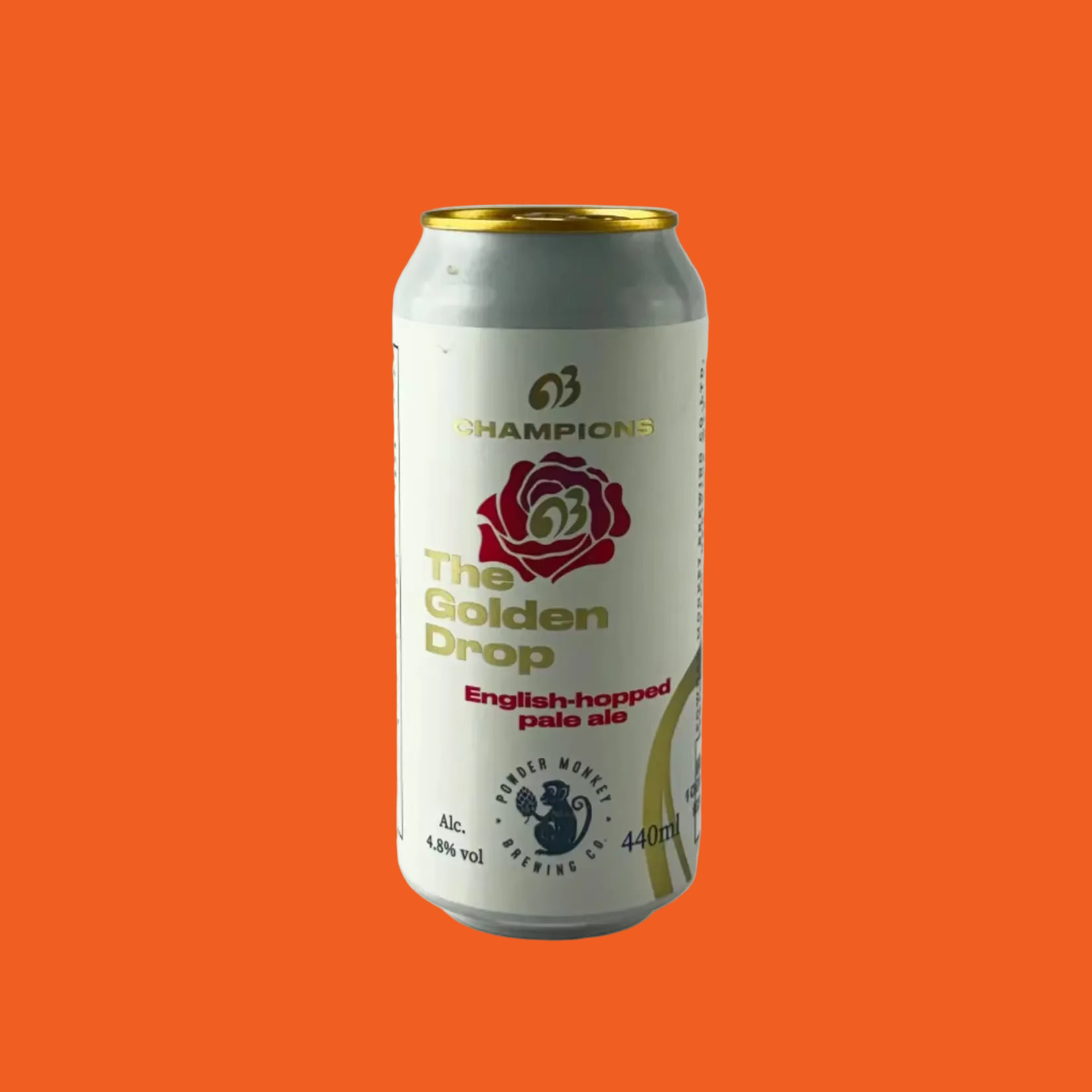 Beer can labeled 'The Golden Drop' on a orange background