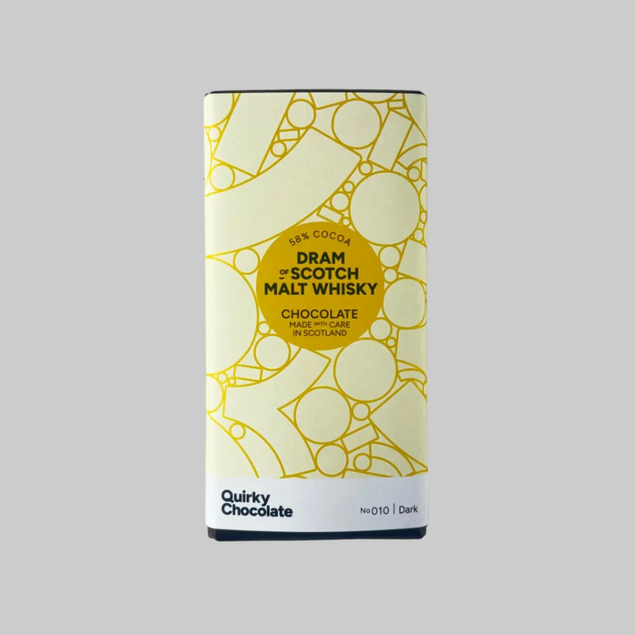 Bar of Quirky Chocolate Dram of Scotch Maly Whisky chocolate with a cream label on a grey background