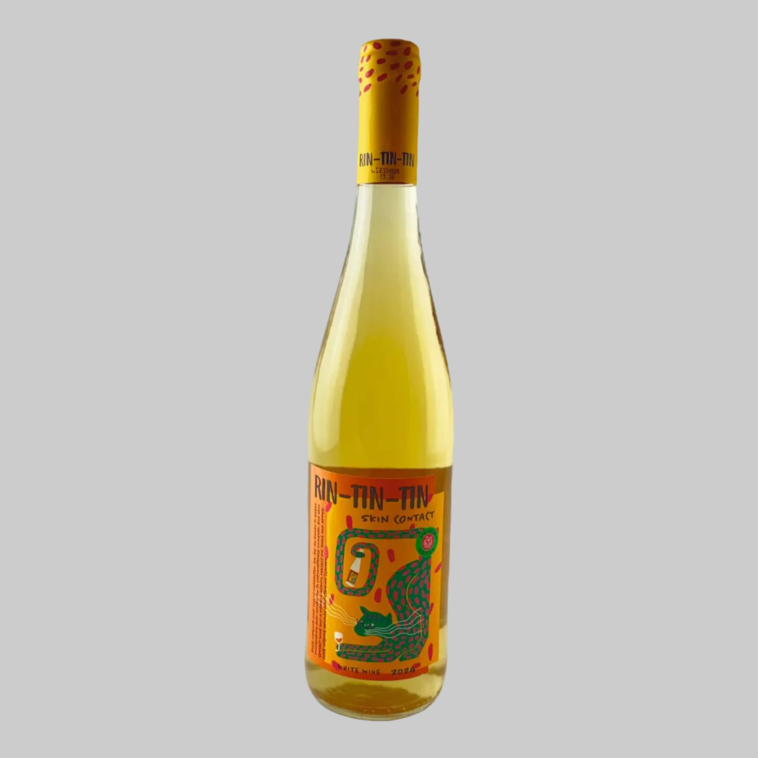 Bottle of skin contact orange wine with a colourful tiger label on a grey background