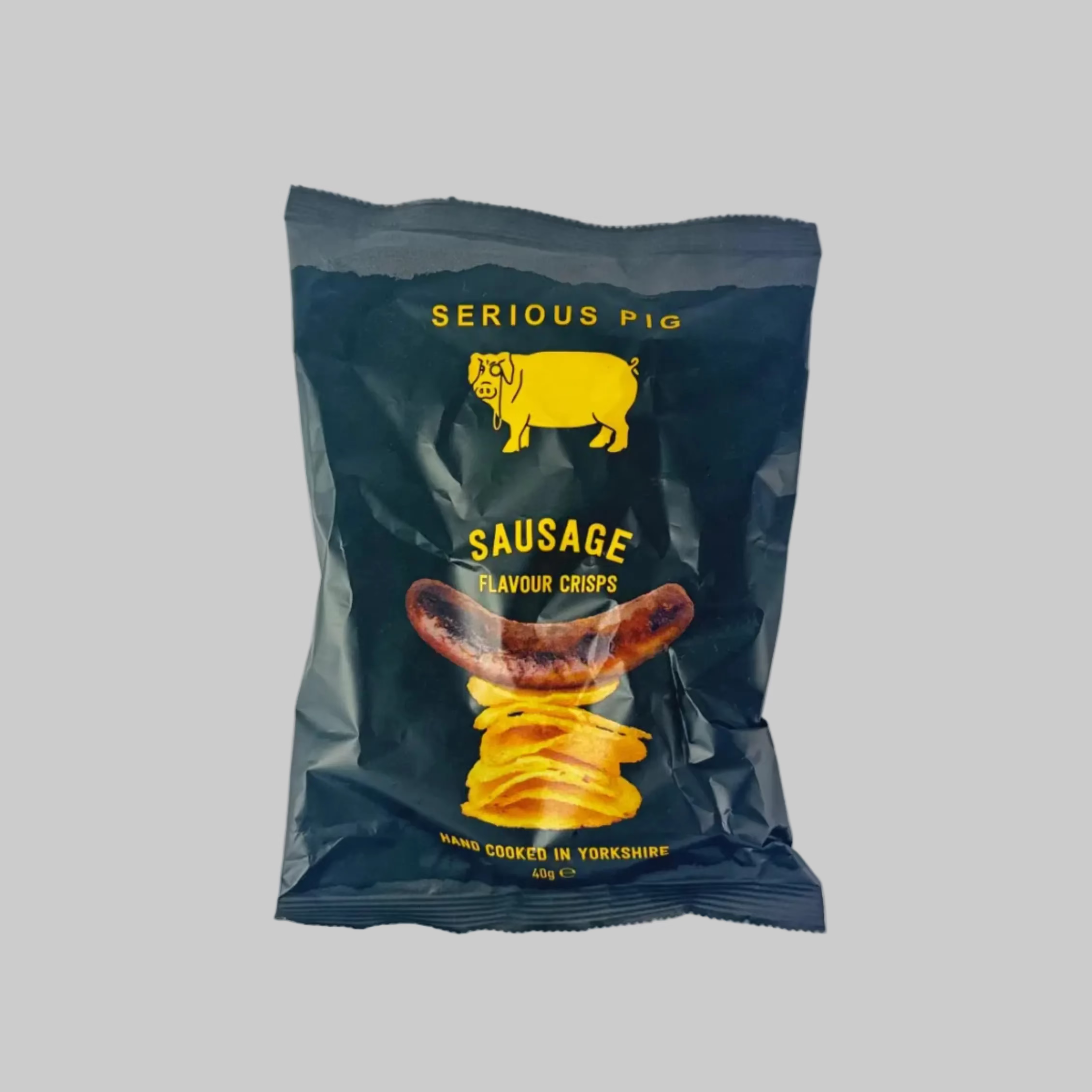 Packaged sausage flavor chips with 'Serious Pig' branding on a grey background