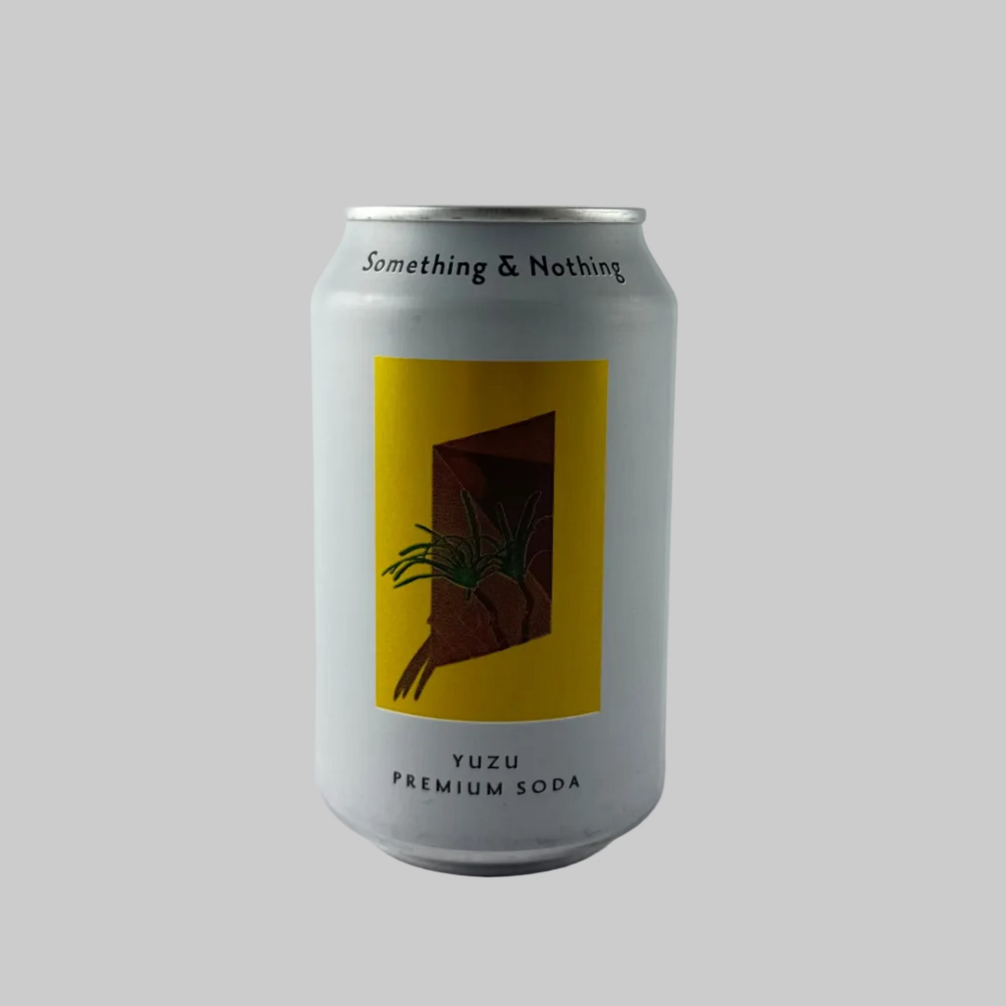 Can of Yuzu Soda from Something & Nothing with a yellow label on a white can and grey background