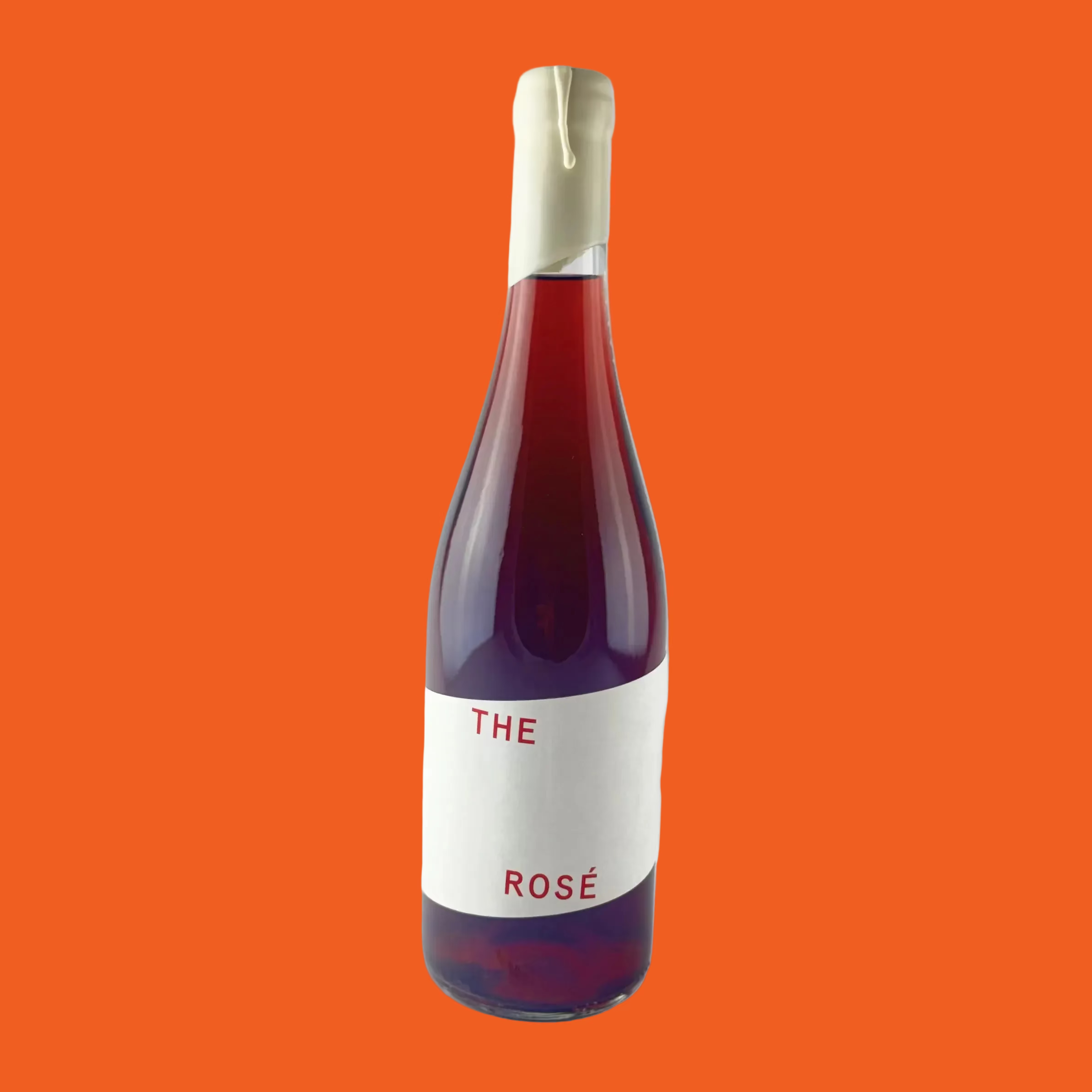 Bottle of 'The Rose' wine with a simple white label on a orange background