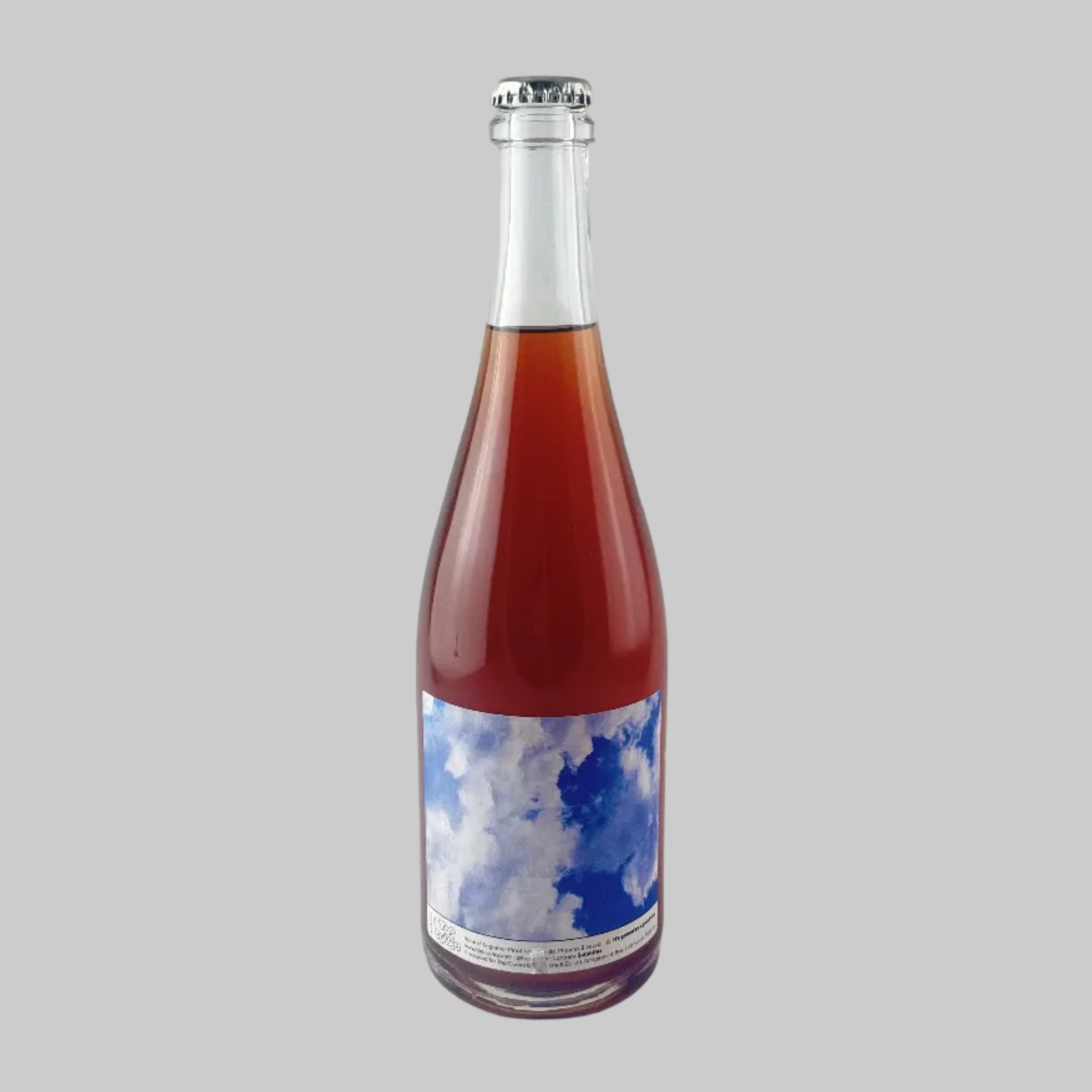 Bottle of Top Cuvee Good Day Pet Nat with a sky image on label on a grey background